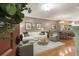 Comfortable living room with hardwood floors, white sectional sofa, and neutral decor at 2728 Wander Ln, Alpharetta, GA 30022