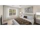 Well-lit primary bedroom featuring a ceiling fan, large window and neutral decor at 3655 Habersham Ne Rd # 203, Atlanta, GA 30305
