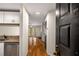 Inviting entryway with hardwood floors leads to a cozy living area and updated kitchen with granite countertops at 3655 Habersham Ne Rd # 203, Atlanta, GA 30305