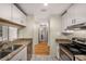 Charming kitchen featuring granite countertops, stainless appliances and wood flooring at 3655 Habersham Ne Rd # 203, Atlanta, GA 30305