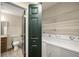 Convenient laundry area with modern appliances located next to half bath at 3655 Habersham Ne Rd # 203, Atlanta, GA 30305