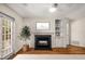 Charming living room featuring a fireplace, built-in shelves, and access to outdoor views at 3655 Habersham Ne Rd # 203, Atlanta, GA 30305