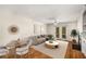 Inviting living room with French doors, a ceiling fan, fireplace, and hardwood floors for a cozy ambiance at 3655 Habersham Ne Rd # 203, Atlanta, GA 30305