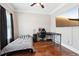 Cozy bedroom with neutral walls, hardwood flooring, and dark curtains, creating a relaxing retreat at 615 Henderson Mill Rd, Covington, GA 30014