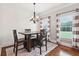 Charming dining area with hardwood floors, stylish lighting, and a cozy atmosphere for Gathering meals at 615 Henderson Mill Rd, Covington, GA 30014