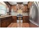 Modern kitchen with stainless steel appliances, granite countertops, and custom cabinetry for a stylish cooking experience at 615 Henderson Mill Rd, Covington, GA 30014