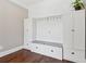 Well-organized mudroom with built-in storage, seating, and ample space for shoes and coats, providing convenience at 615 Henderson Mill Rd, Covington, GA 30014