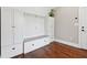 Bright mudroom boasts custom built-ins, coat hooks, and comfortable bench seating, perfect for organization at 615 Henderson Mill Rd, Covington, GA 30014