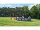 Enjoy this above ground pool with an attached deck overlooking a vast yard at 615 Henderson Mill Rd, Covington, GA 30014