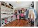Spacious walk-in closet with organized shelving and hanging rods, providing ample storage for clothing and accessories at 615 Henderson Mill Rd, Covington, GA 30014