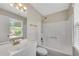 Bright bathroom featuring a shower-tub combination and a vanity sink at 1368 Poplar Pointe Se, Smyrna, GA 30082