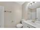 Bright bathroom featuring white vanity and a mirror with decorative lighting at 1368 Poplar Pointe Se, Smyrna, GA 30082