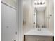 Cozy bathroom featuring a single sink vanity, and a large mirror at 1368 Poplar Pointe Se, Smyrna, GA 30082