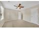 Bedroom featuring neutral carpeting, a ceiling fan, and a large closet at 1368 Poplar Pointe Se, Smyrna, GA 30082