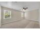 Bedroom featuring neutral carpeting and large windows at 1368 Poplar Pointe Se, Smyrna, GA 30082
