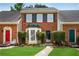 Charming brick townhouse with manicured front lawn and bay window at 1368 Poplar Pointe Se, Smyrna, GA 30082