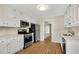 Modern kitchen featuring white cabinets, quartz countertops, and stainless steel appliances at 1368 Poplar Pointe Se, Smyrna, GA 30082