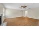 Spacious living room features wood flooring and a ceiling fan at 1368 Poplar Pointe Se, Smyrna, GA 30082