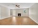 Bright living room featuring a cozy fireplace and wood-look floors at 1368 Poplar Pointe Se, Smyrna, GA 30082
