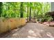 Backyard area with a wooden fence and landscaping at 148 Bramble Oak Dr, Woodstock, GA 30188