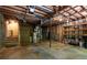 Unfinished basement with stairs, concrete floor, utility systems, and storage space at 148 Bramble Oak Dr, Woodstock, GA 30188