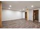 Spacious basement featuring recessed lighting, new vinyl flooring, and closet at 148 Bramble Oak Dr, Woodstock, GA 30188