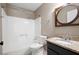 Bathroom featuring a tub and shower combination and granite countertops at 148 Bramble Oak Dr, Woodstock, GA 30188