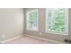 Cozy bedroom with natural light from two windows at 148 Bramble Oak Dr, Woodstock, GA 30188