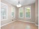 Cozy dining room area filled with natural light from the surrounding windows at 148 Bramble Oak Dr, Woodstock, GA 30188