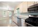 Open kitchen features stainless steel appliances and plenty of counter space at 148 Bramble Oak Dr, Woodstock, GA 30188