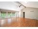 Spacious living room with hardwood flooring, vaulted ceilings, and access to an outdoor deck at 148 Bramble Oak Dr, Woodstock, GA 30188