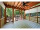 Screened-in porch overlooking a wooded area, perfect for enjoying nature at 148 Bramble Oak Dr, Woodstock, GA 30188