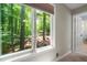 A window provides a calming view of the wooded outdoors at 148 Bramble Oak Dr, Woodstock, GA 30188
