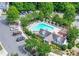 Inviting community pool with lounge chairs, parking, and well-maintained landscaping at a Mill Creek Lakes property at 2141 Spikerush Way, Buford, GA 30519