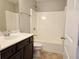 Standard bathroom with shower-tub combo and solid surface vanity at 2141 Spikerush Way, Buford, GA 30519