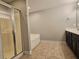 Bright bathroom with a walk-in shower, bathtub, and double vanity at 2141 Spikerush Way, Buford, GA 30519