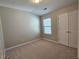 Cozy bedroom with carpet, neutral colors, and closet at 2141 Spikerush Way, Buford, GA 30519