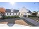 Clubhouse with a stone walkway and professional landscaping in front at 2141 Spikerush Way, Buford, GA 30519