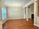 Open dining area with hardwood floors, natural light, and seamless flow to the living room and kitchen at 2141 Spikerush Way, Buford, GA 30519
