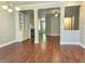 Dining room with hardwood floors and seamless flow to the living area, offering an open layout at 2141 Spikerush Way, Buford, GA 30519