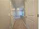 Hallway with neutral walls and carpet leads to other rooms at 2141 Spikerush Way, Buford, GA 30519