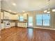 Bright kitchen features stainless steel appliances and hardwood floors at 2141 Spikerush Way, Buford, GA 30519