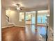 Spacious living room with hardwood floors, fireplace, and seamless flow into the adjacent kitchen and dining area at 2141 Spikerush Way, Buford, GA 30519