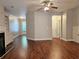 Open living room featuring hardwood floors, built-in shelving, and seamless flow to the outdoors at 2141 Spikerush Way, Buford, GA 30519