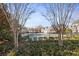 Community pool enclosed with black metal fencing and shrubbery around the outside at 2141 Spikerush Way, Buford, GA 30519