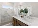 Bright bathroom features double vanity, marble tile shower, and modern fixtures at 2535 Astaire Ct, Atlanta, GA 30318