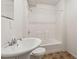 Bathroom featuring a pedestal sink, toilet, and shower with a clear glass door at 33 Evans Point Pt, Dallas, GA 30157