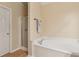 Bathroom features a stand up shower and oversized tub with a mounted towel rack at 33 Evans Point Pt, Dallas, GA 30157