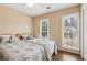 Well-lit bedroom with two twin beds, natural light from two windows, and a ceiling fan at 33 Evans Point Pt, Dallas, GA 30157