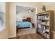 Bedroom view from the office entrance with bookshelf and natural light from the windows at 33 Evans Point Pt, Dallas, GA 30157